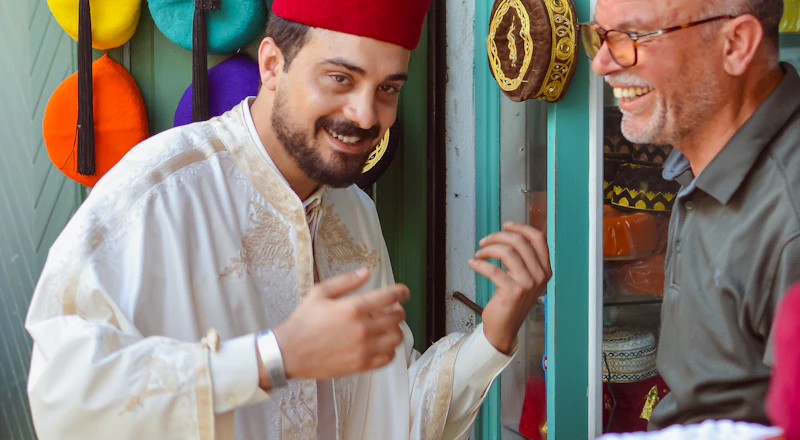 A traveler chatting with a vendor at a market stall